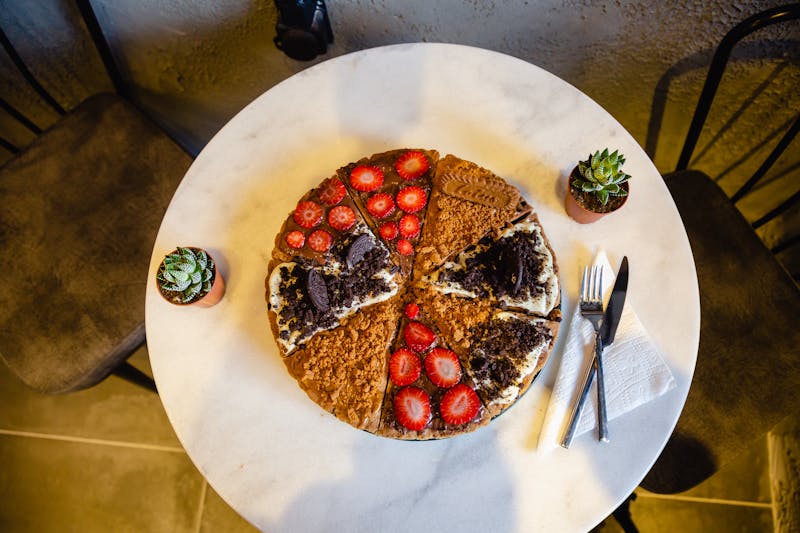 Pizza being baked in the wood-fired stone oven at 900 degrees
